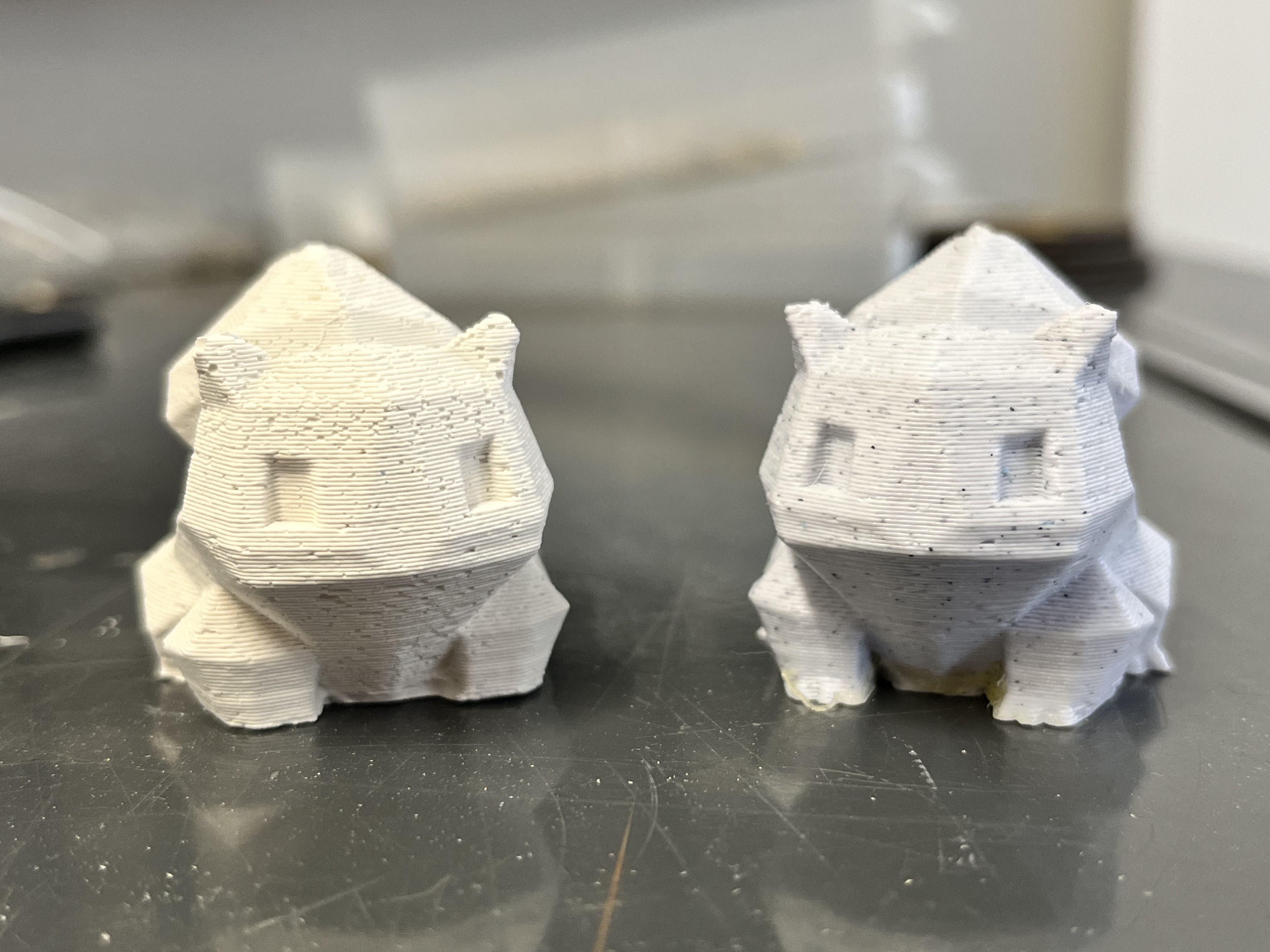 Plaster Bulbasaur alongside 3D original